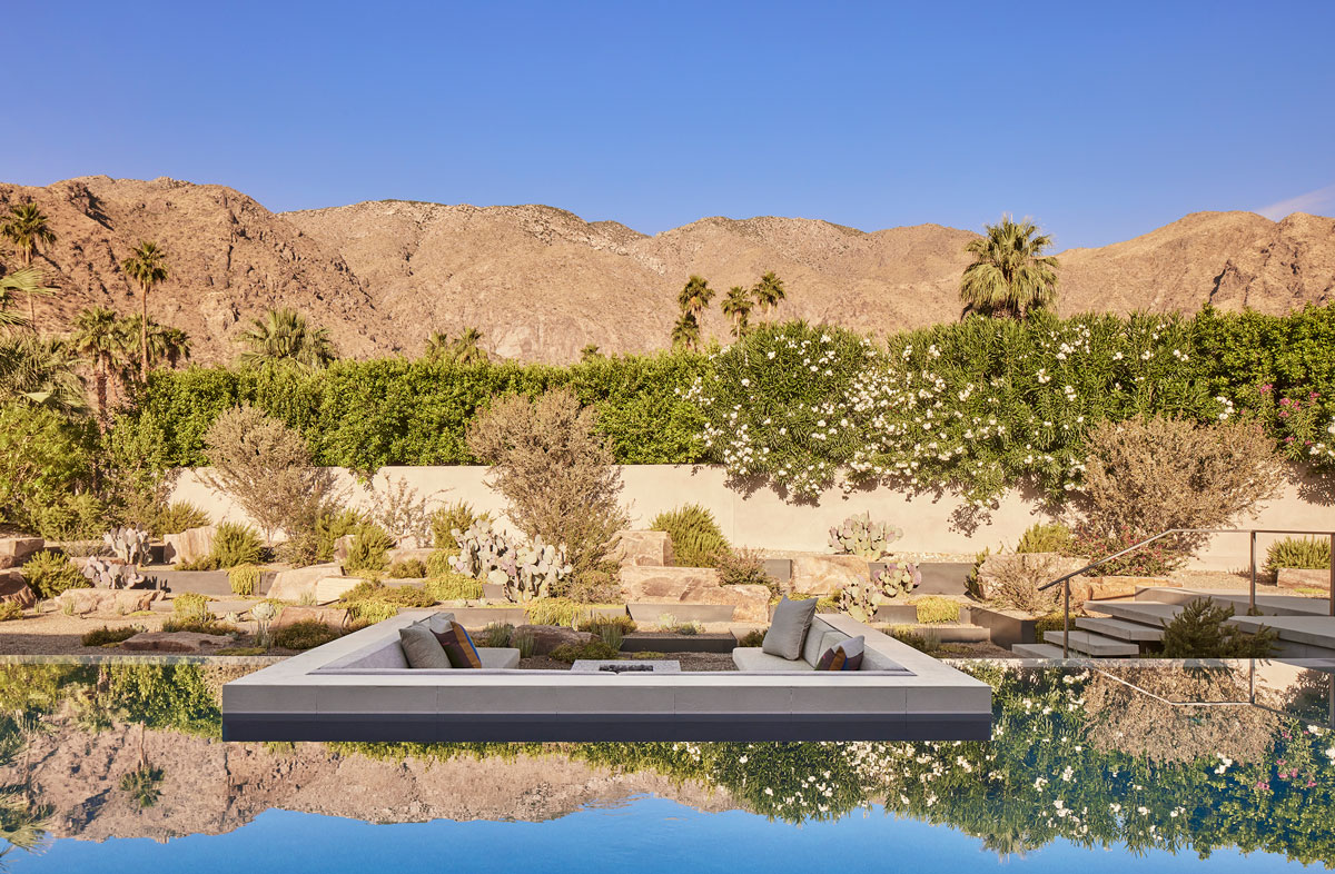 View of sunken sofa next to an infinity pool at Slot Canyon residence
