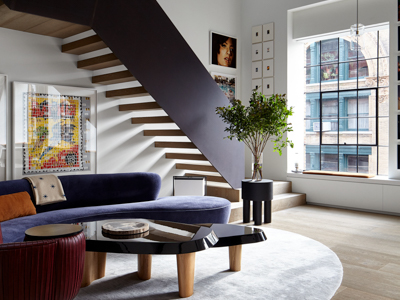 Living room space with stairs at Gallery Loft in New York